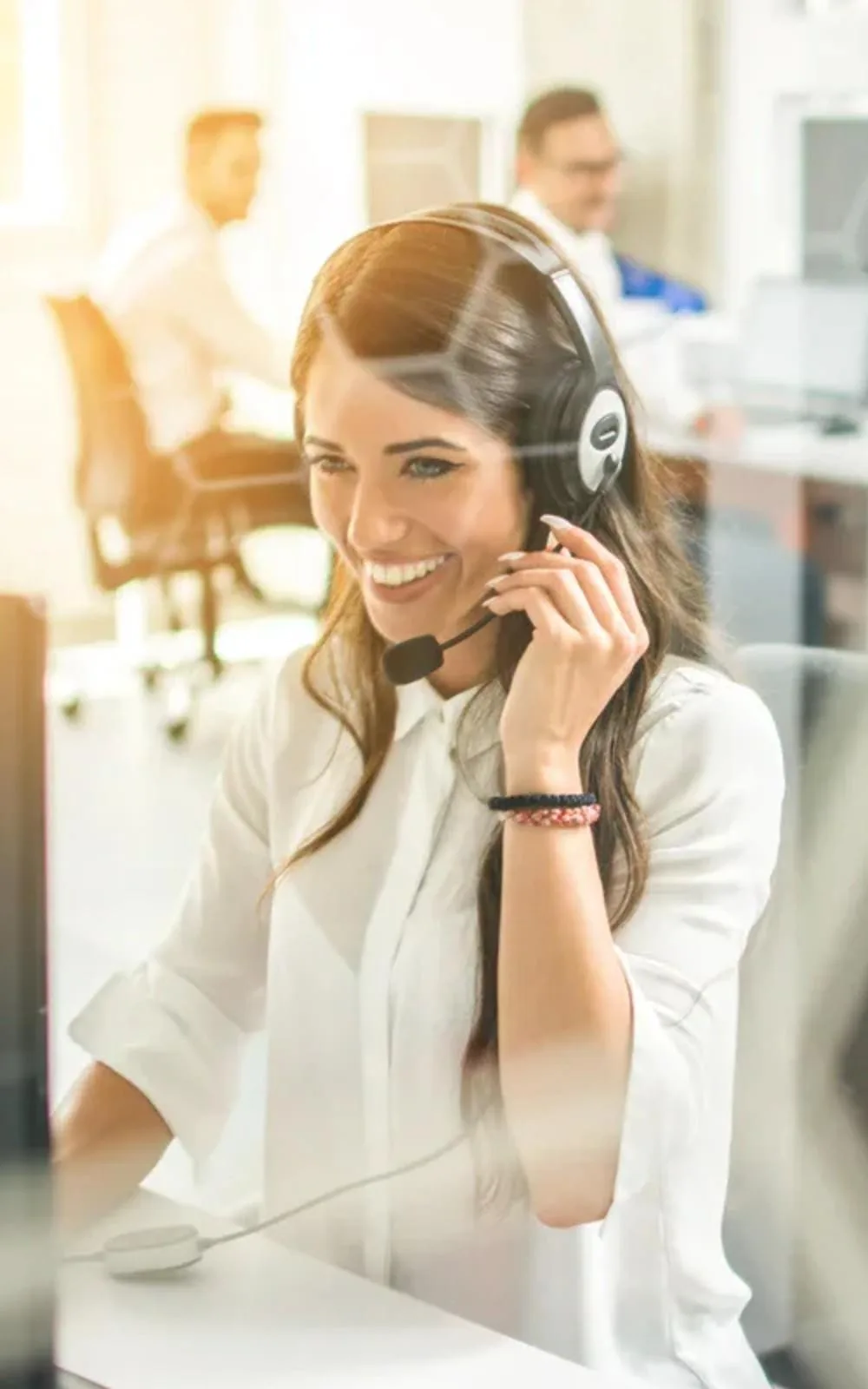 Telephone service employee with headset